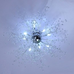 Lampadario moderno in metallo cromato con cristallo a globo
