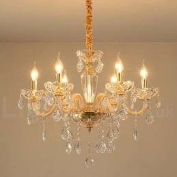 Lampadario in oro con candela in cristallo trasparente