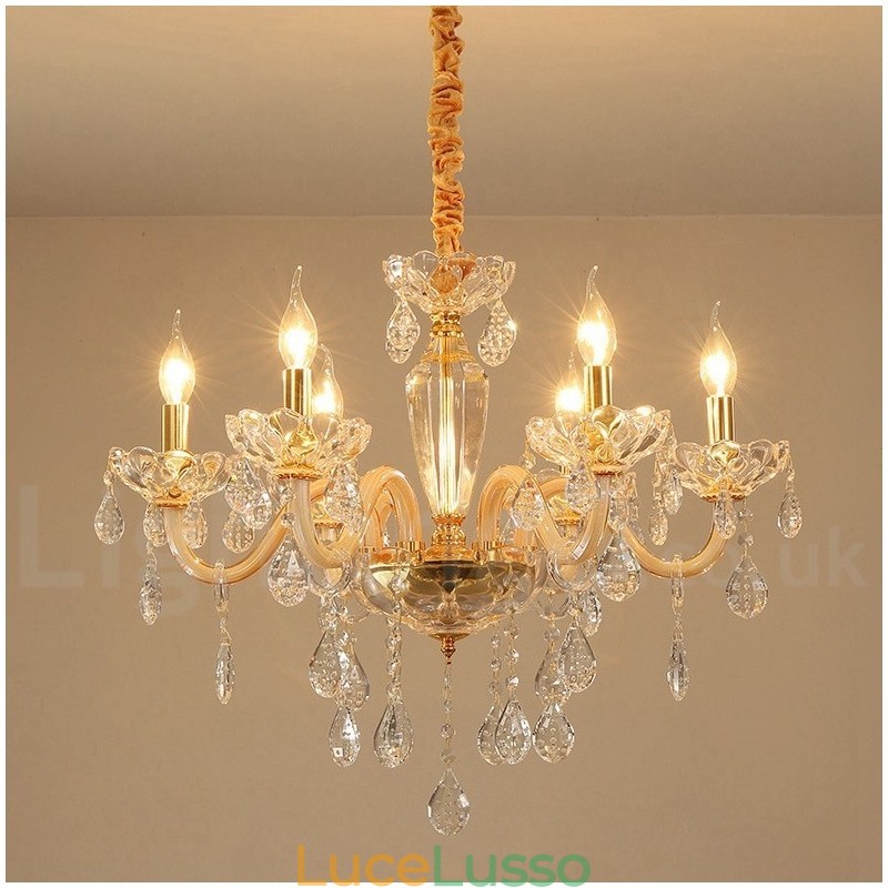 Lampadario in oro con candela in cristallo trasparente