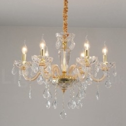 Lampadario in oro con candela in cristallo trasparente