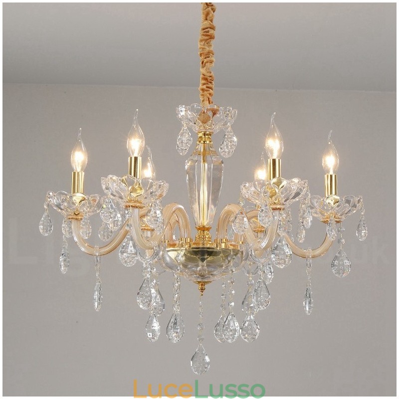 Lampadario in oro con candela in cristallo trasparente