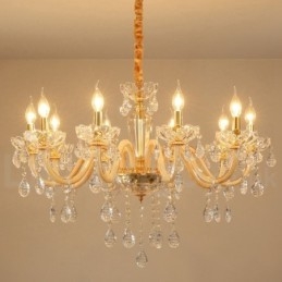 Lampadario in oro con candela in cristallo trasparente