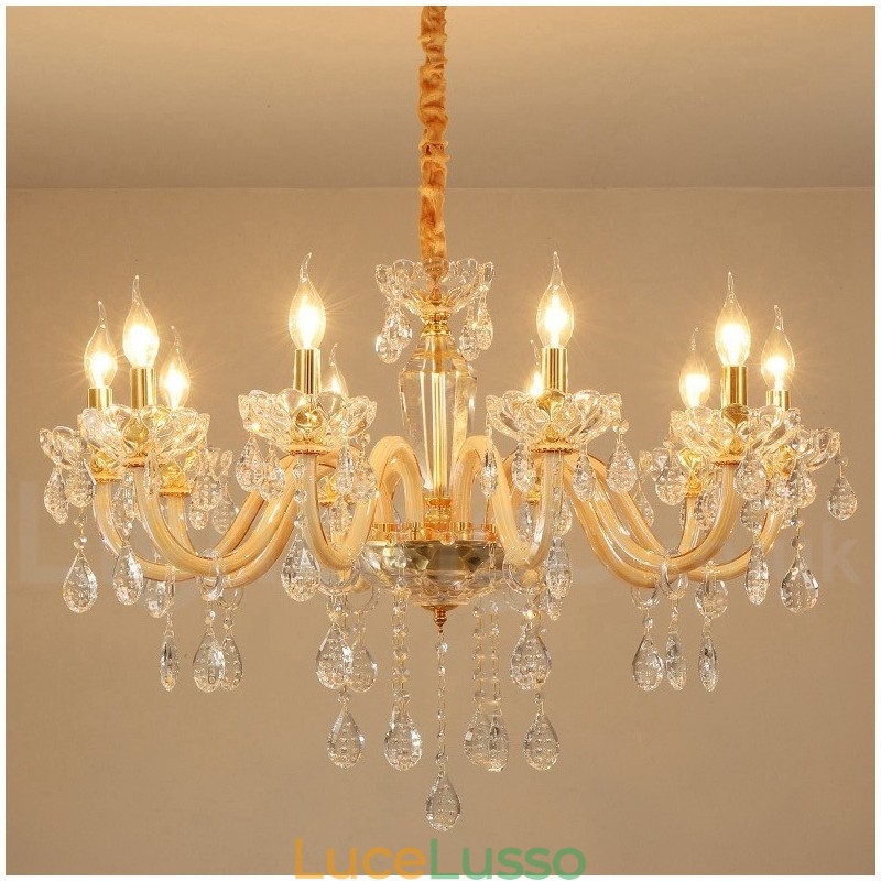 Lampadario in oro con candela in cristallo trasparente