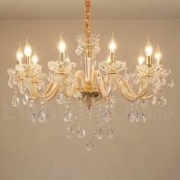 Lampadario in oro con candela in cristallo trasparente