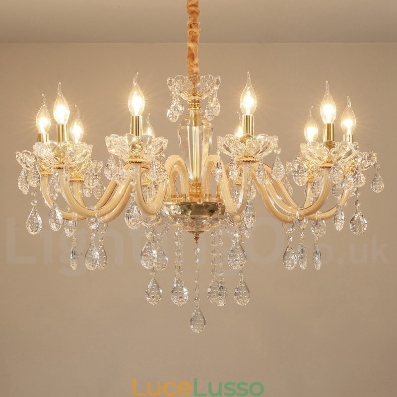 Lampadario in oro con candela in cristallo trasparente