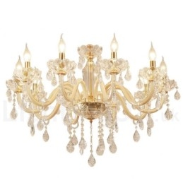 Lampadario in oro con candela in cristallo trasparente