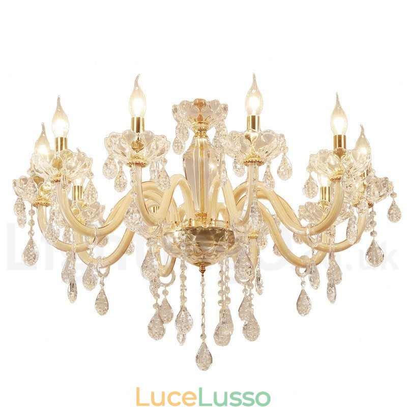 Lampadario in oro con candela in cristallo trasparente