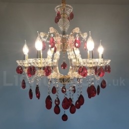 Lampadario a 6 luci con candela dorata e cristallo rosso