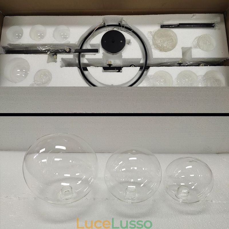Lampadario moderno in metallo con bolle di vetro trasparente