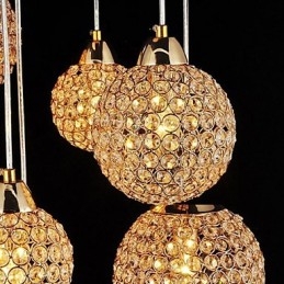 Lampada a sospensione moderna e contemporanea in metallo elettroplaccato con cristallo a globo