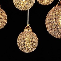 Lampada a sospensione moderna e contemporanea in metallo elettroplaccato con cristallo a globo